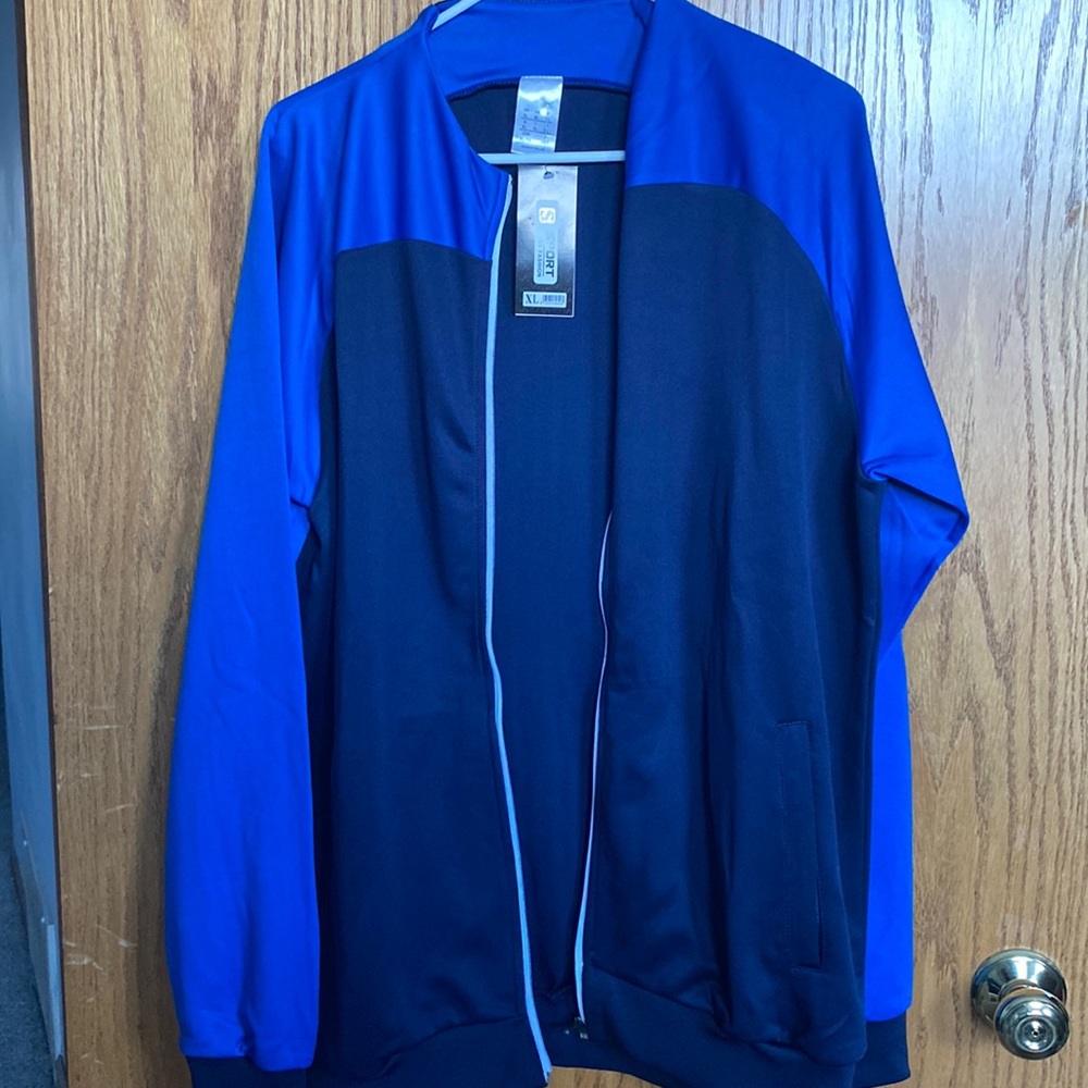 A blue performance zip up warm-up, XL Slim fit
